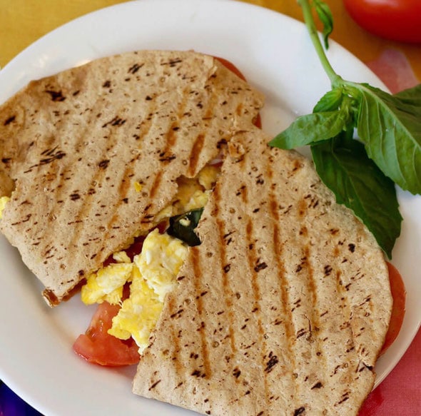 Panini with scrambled eggs and tomatoes